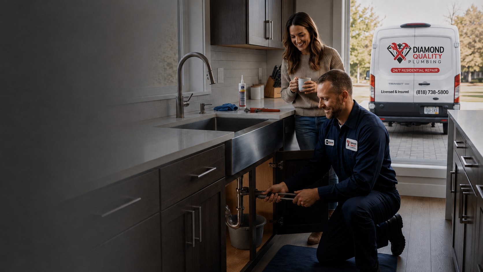 Diamond Quality Plumbing technician at work in a modern kitchen